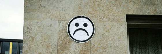 sad smiley street art